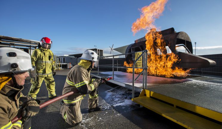 Firefighters fighting helicopter fire